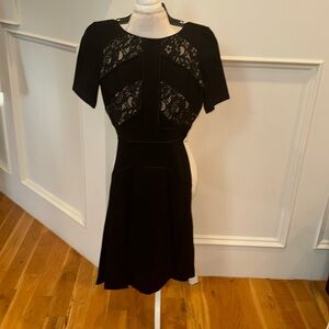 Black dress with short sleeves and a line skirt  size 6